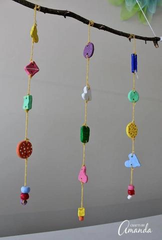 multicolored clay shapes hung as a wind chime