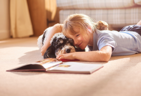 Child and Dog Reading