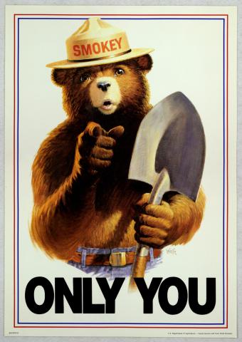 Smokey Bear holding shovel