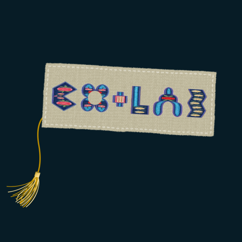 an image of a fabric bookmark that says "CO+LAB" on it