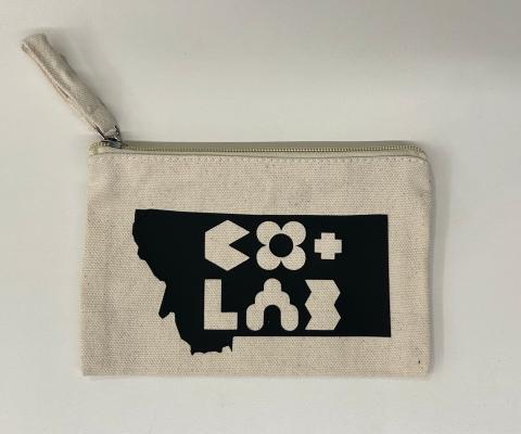 an image of a small canvas zipper pouch with design of the state of Montana and CO+LAB ironed on to the front with heat transfer vinyl 