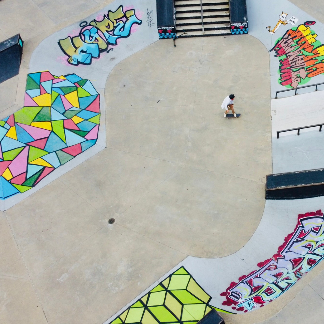 a birds eye view of a skateboarder riding around the Billings Skatepark 